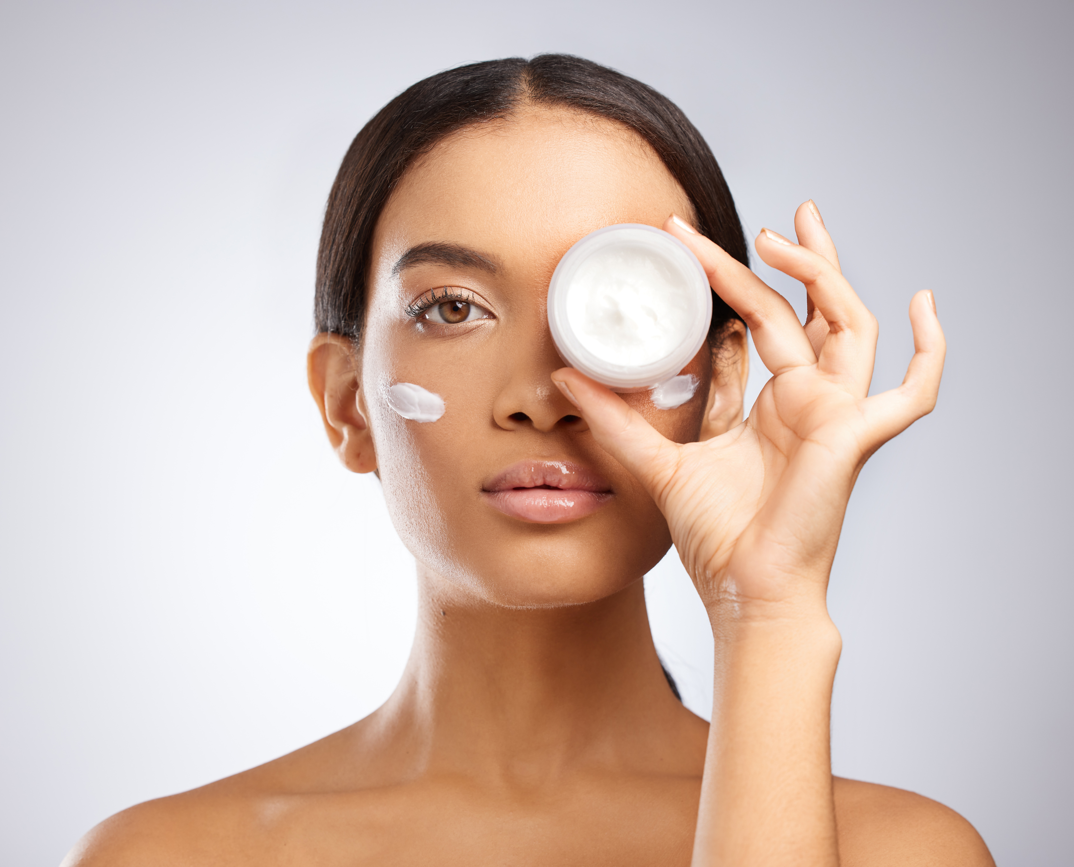 Sunlit portrait highlighting glowing, radiant skin after using Neuro Glow skincare